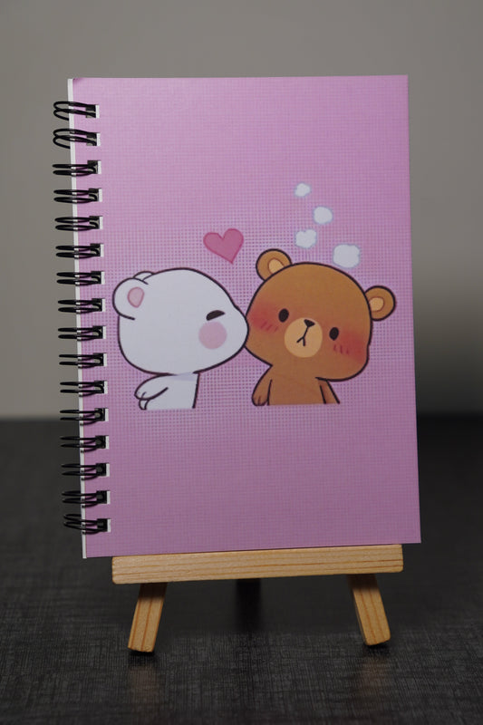 Notebook with cartoon characters on a dark surface