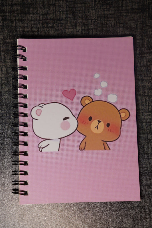 Notebook with cartoon character on a pink cover against a dark textured background